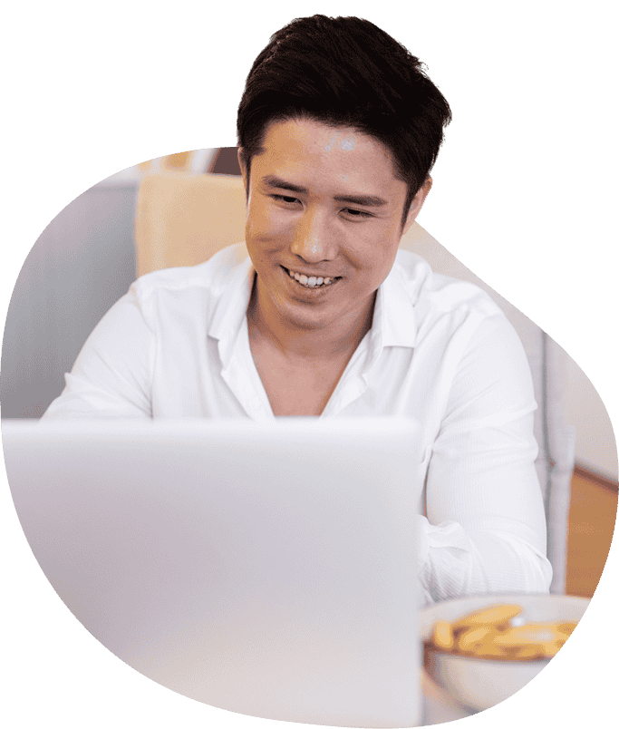 male student uses laptop